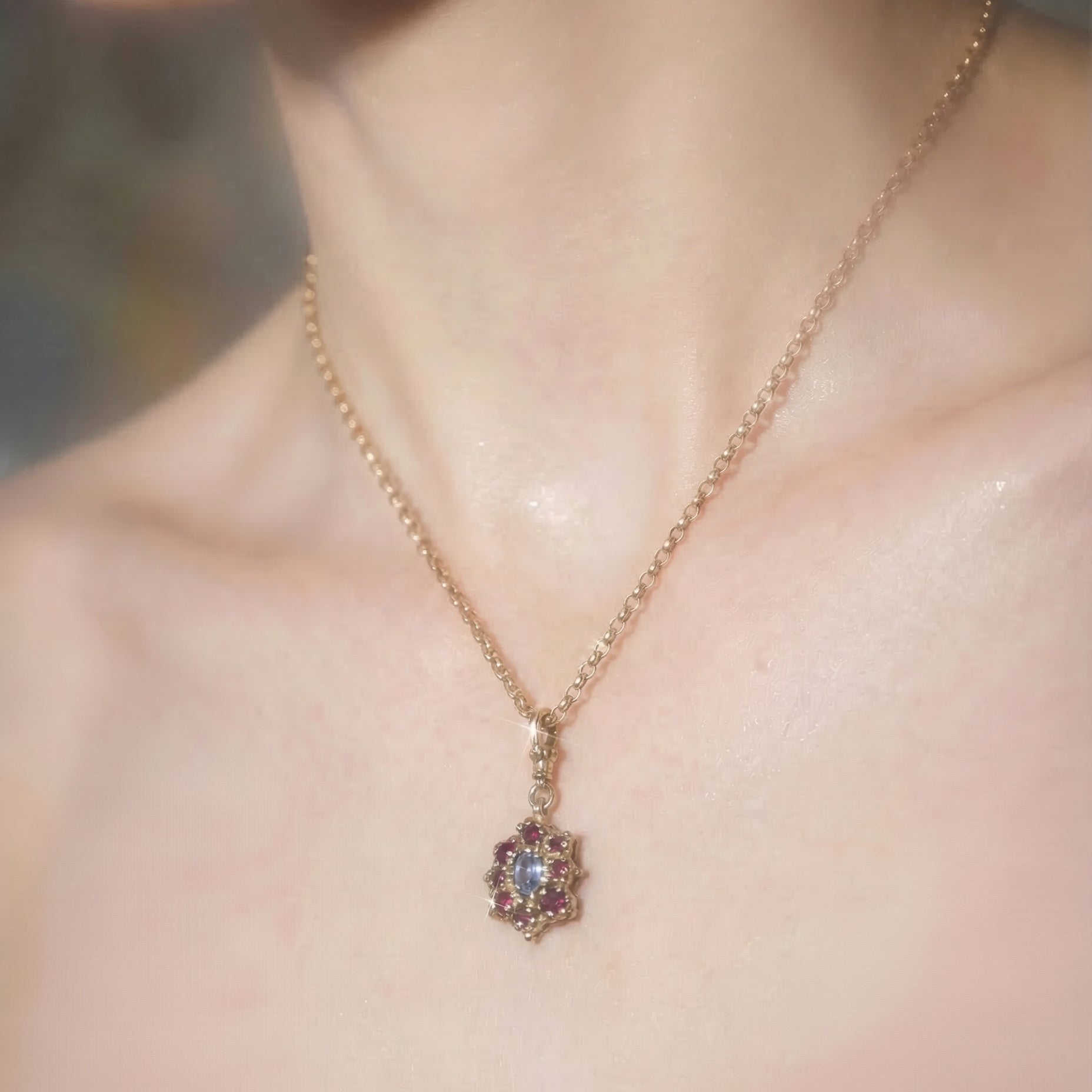 9ct yellow gold pendant Necklace with central lilac sapphire with surrounding rubies