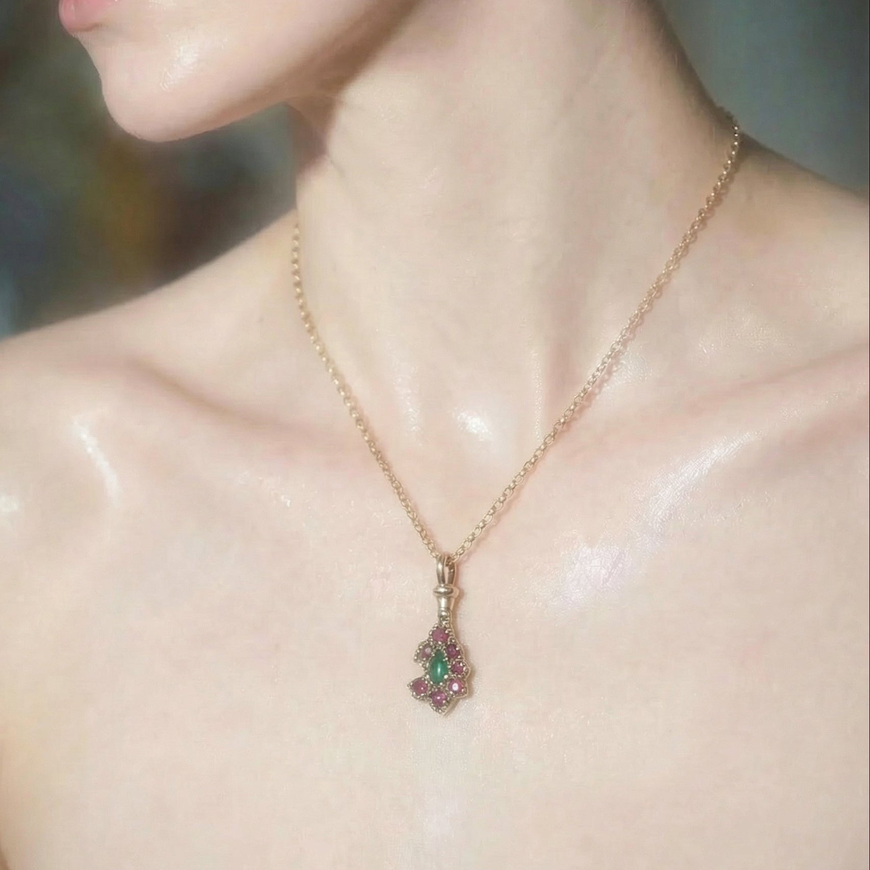 9ct yellow gold victorian inspired pendant necklace set with a central teardrop emerald and surrounding rubies