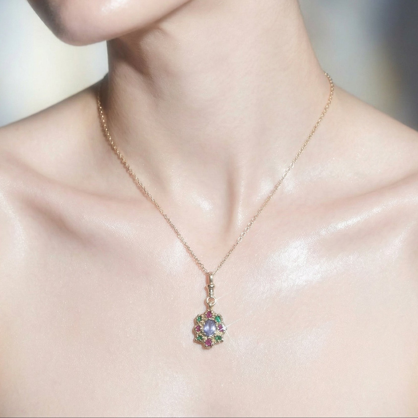 9ct yellow gold charm necklace, victorian inspired, set with central sapphire and surrounding rubies and emeralds