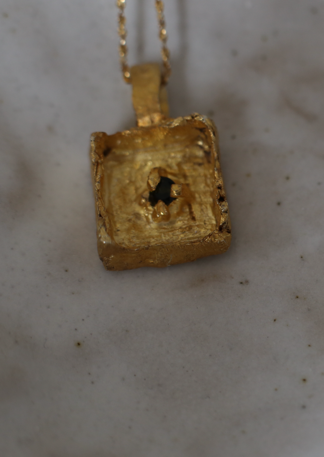 The Quadrata Sunken tourmaline Amulet Necklace.