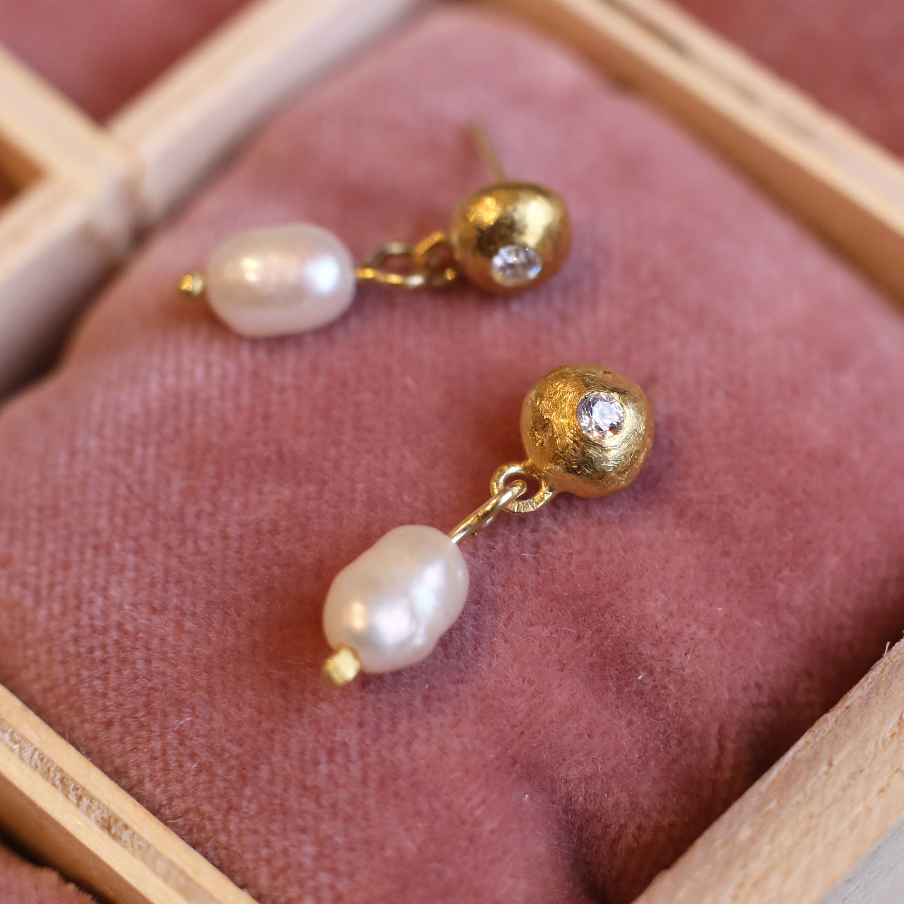 Gold plated, sterling silver earrings with freshwater pearl drops