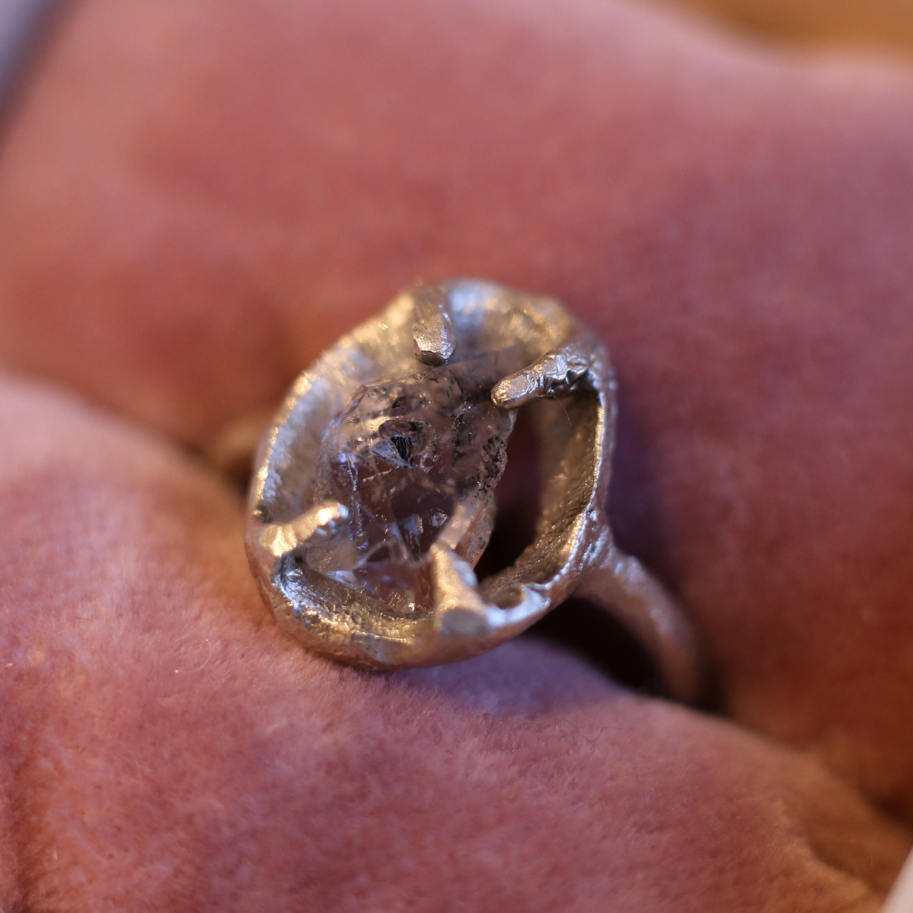 Framed sterling silver ring set with a raw herkimer diamond