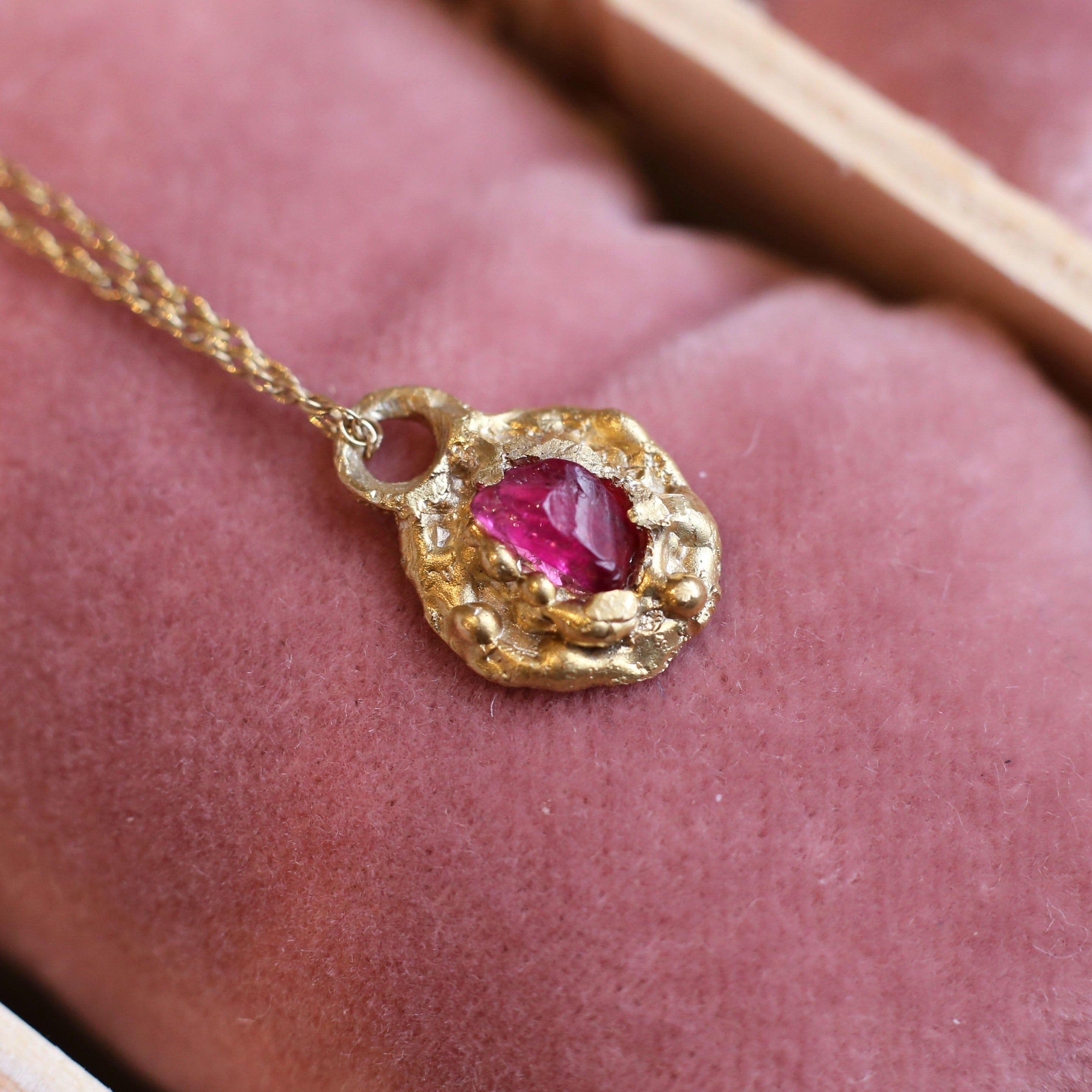 Gold plated sterling silver necklace, in organic style with raw pink tourmaline with a matching gold plated 18 inch chain