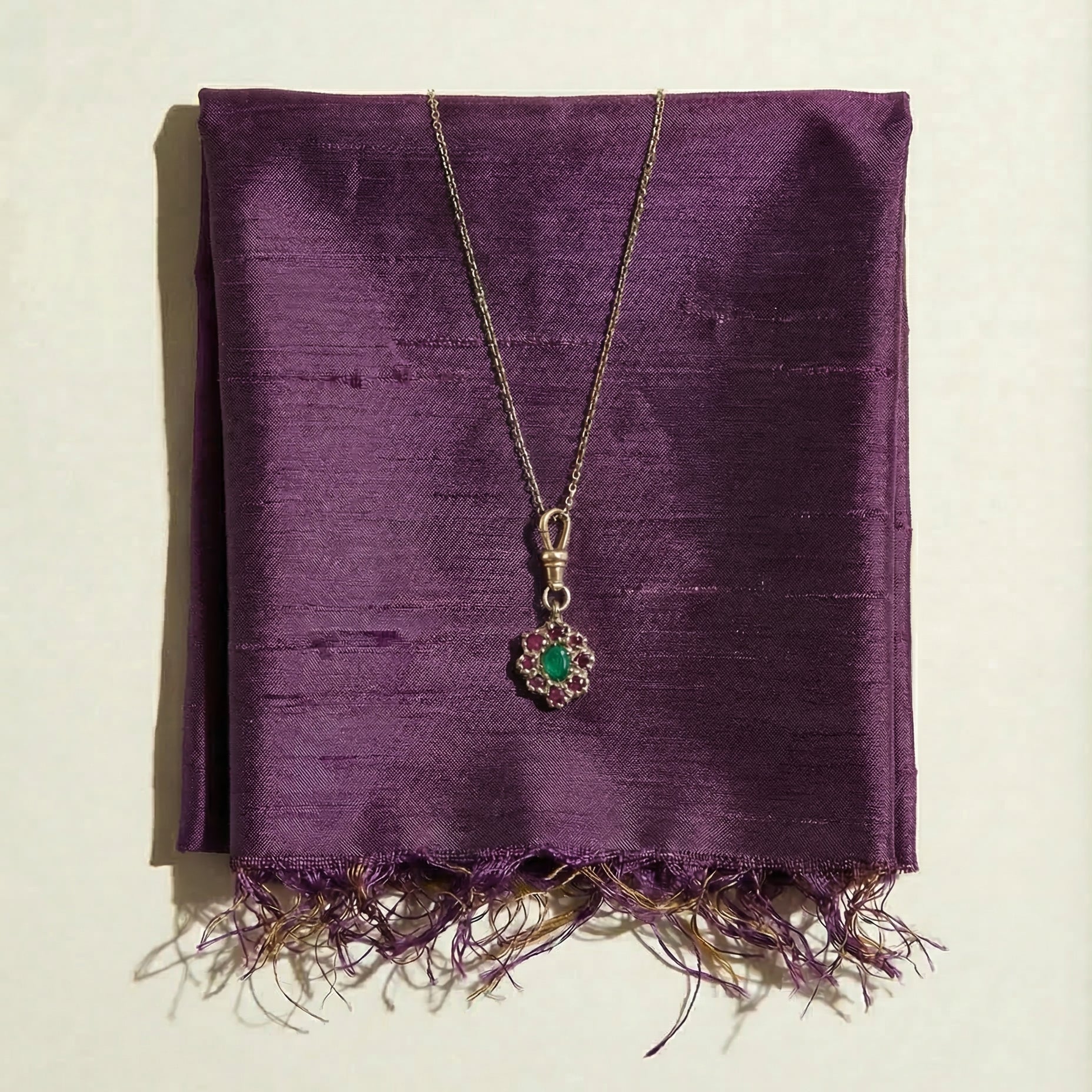 9ct yellow gold charm victorian inspired necklace with central emerald and surrounding rubies