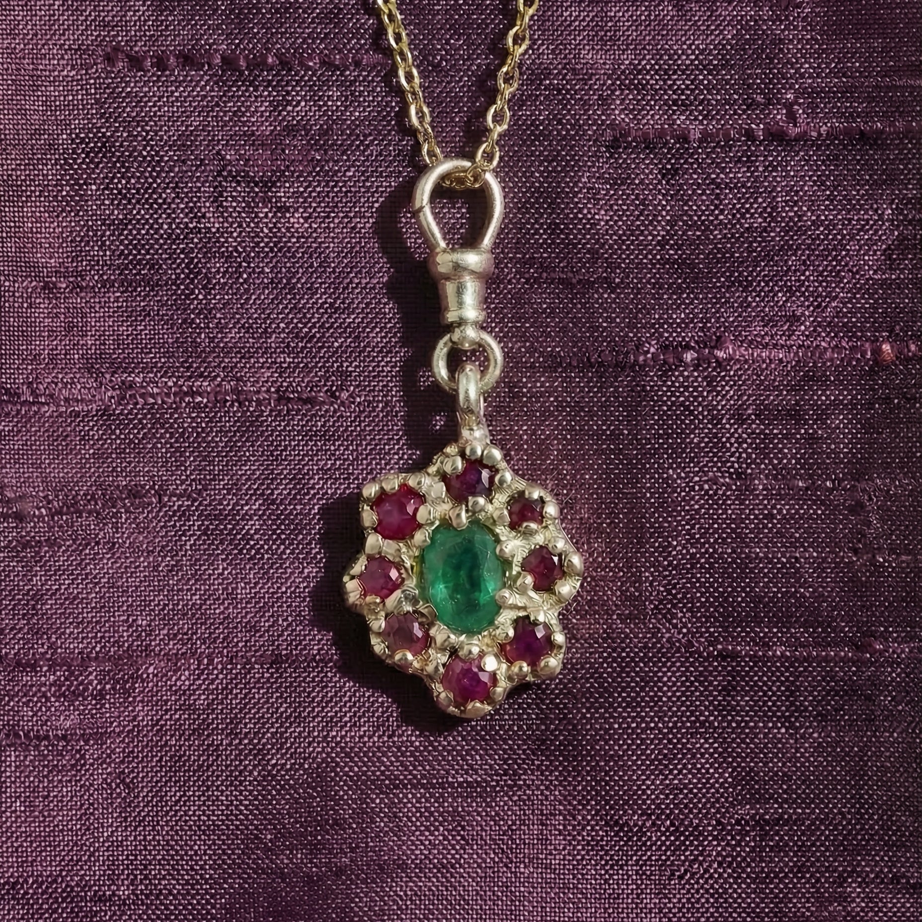9ct yellow gold victorian inspired with central emerald and surrounding rubies
