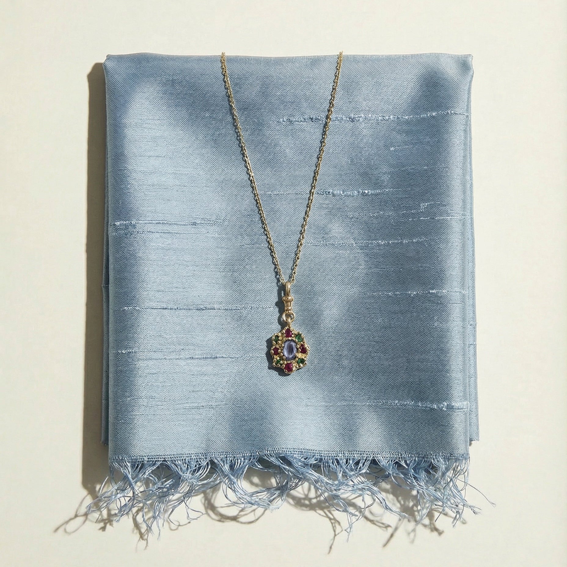 9ct yellow gold charm necklace, victorian inspired, set with central sapphire and surrounding rubies and emeralds