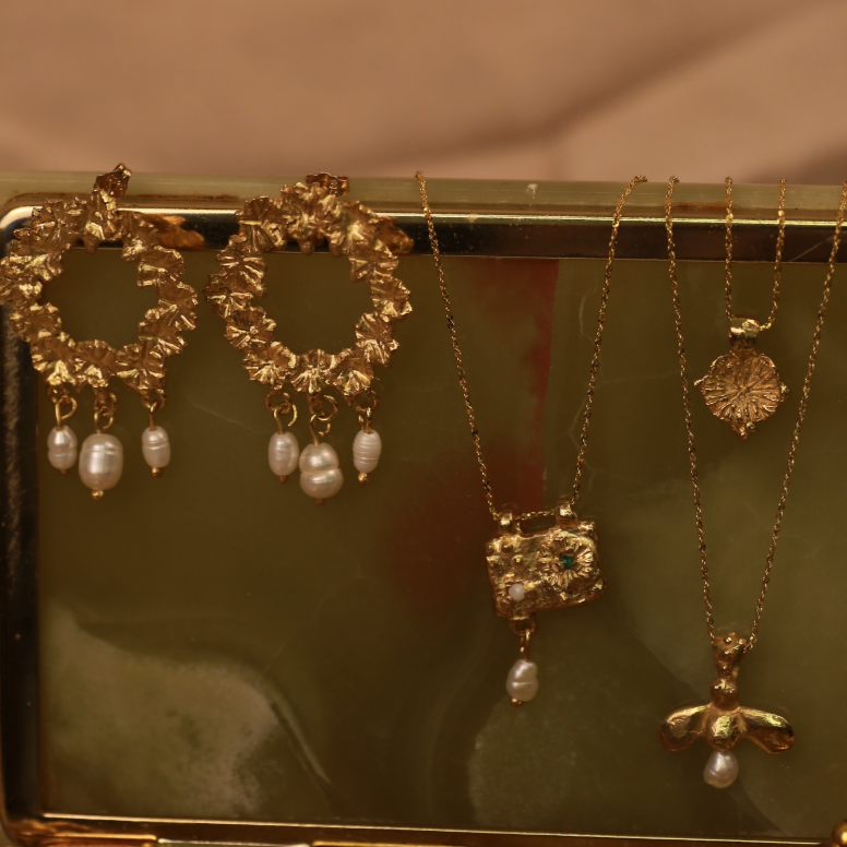 the bee wreath earrings in gold vermeil shot on jewellery box