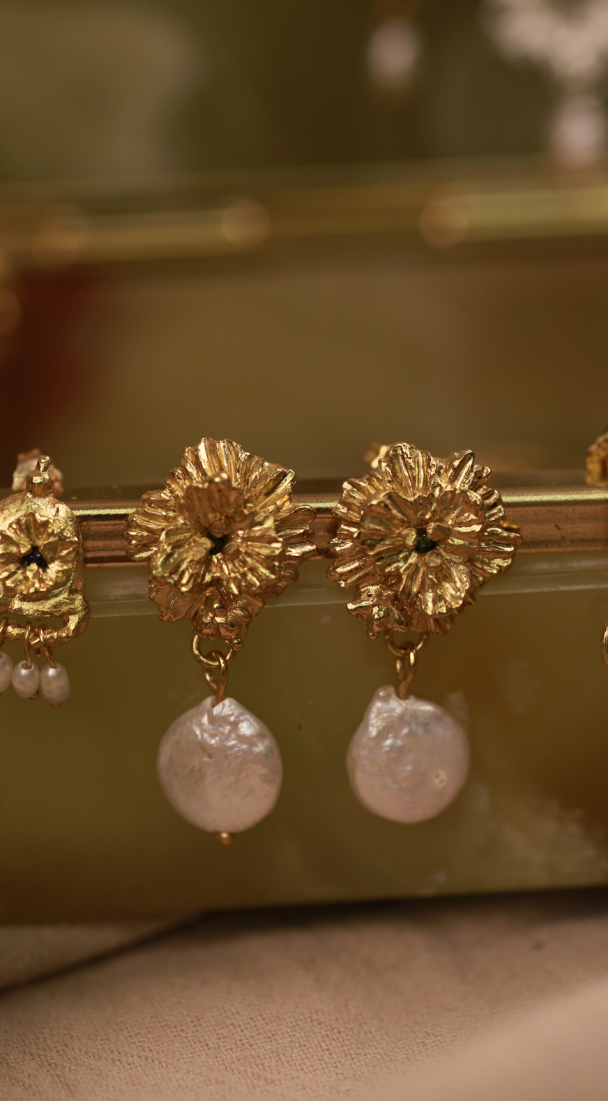  the clematis II earrings gold vermeil lifestyle shot on jewellery box