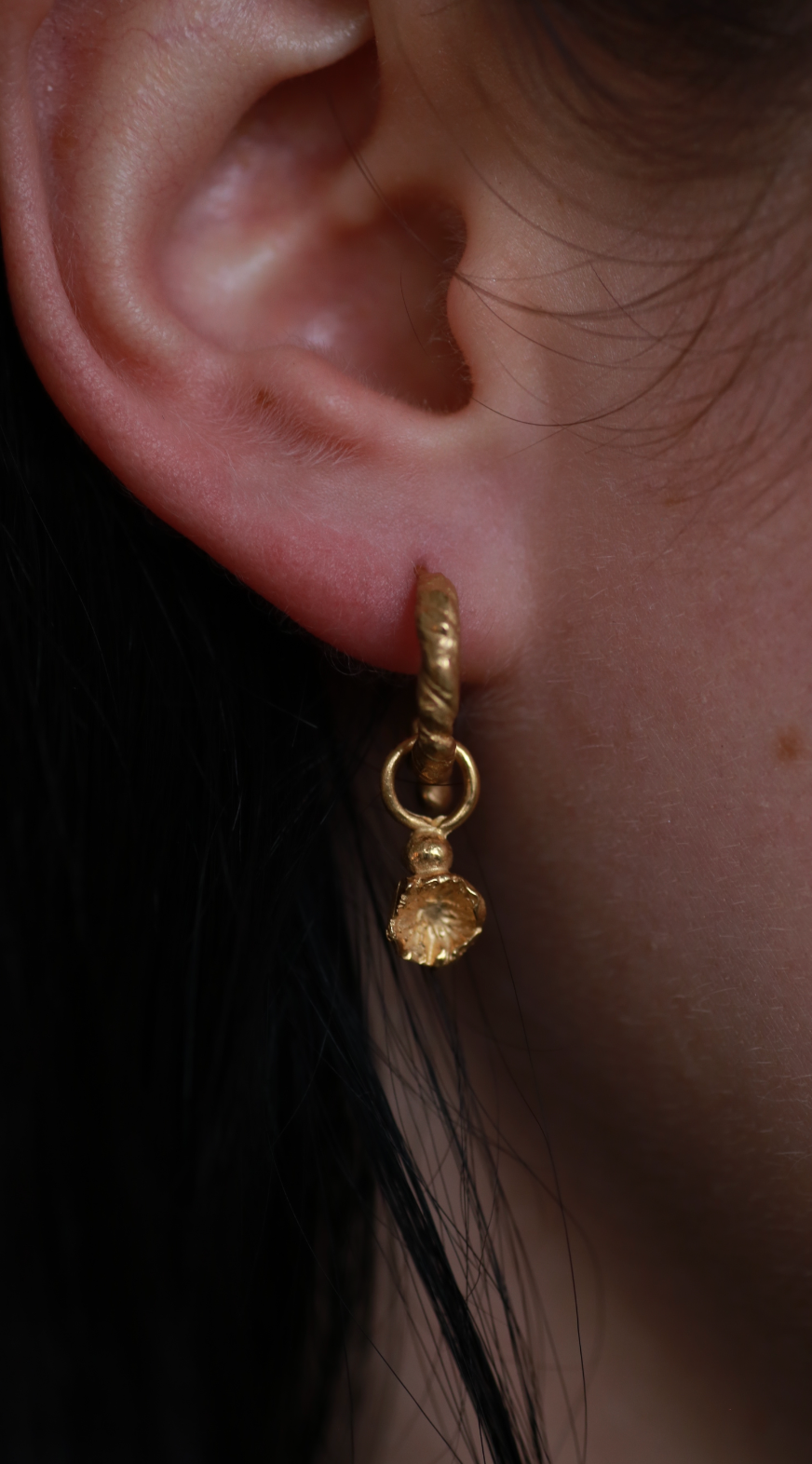the flower drop earrings gold vermeil worn on model