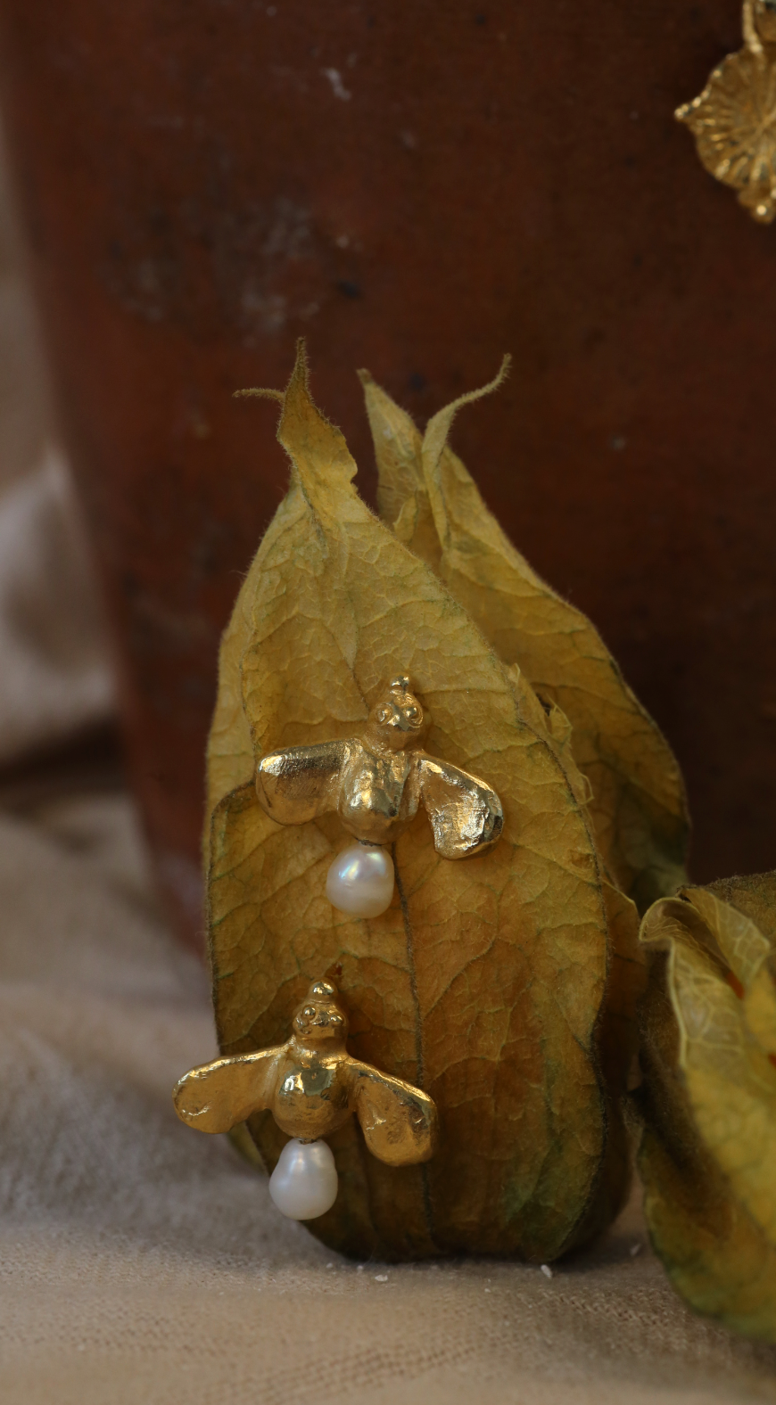 the honey bee studs in gold vermeil lifestyle shot