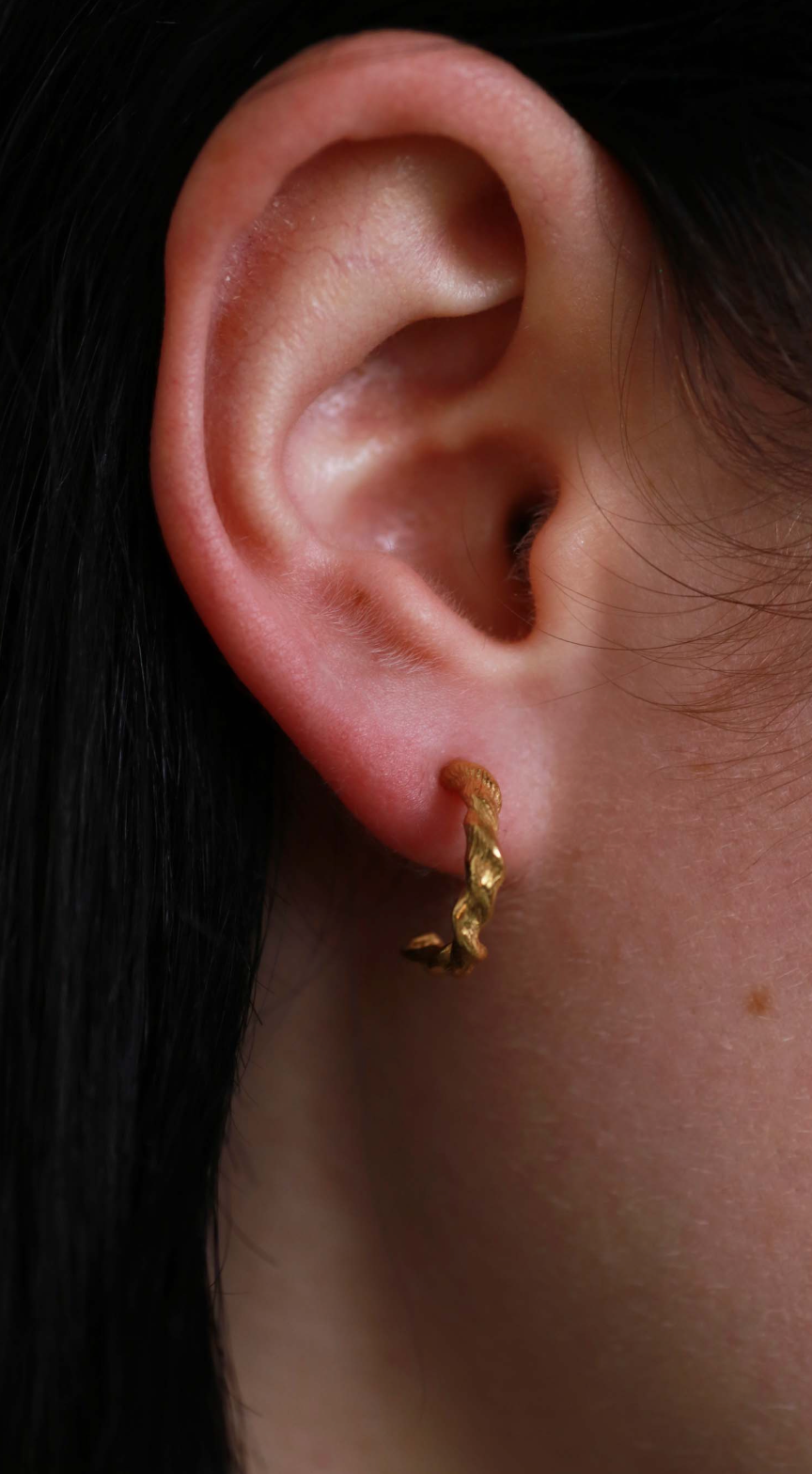 the twisted beeswax hoops gold vermeil model shot