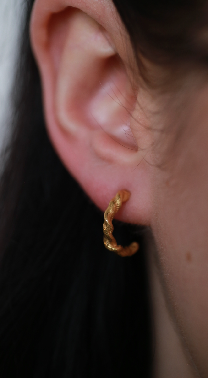 the twisted beeswax hoops gold vermeil model shot front view