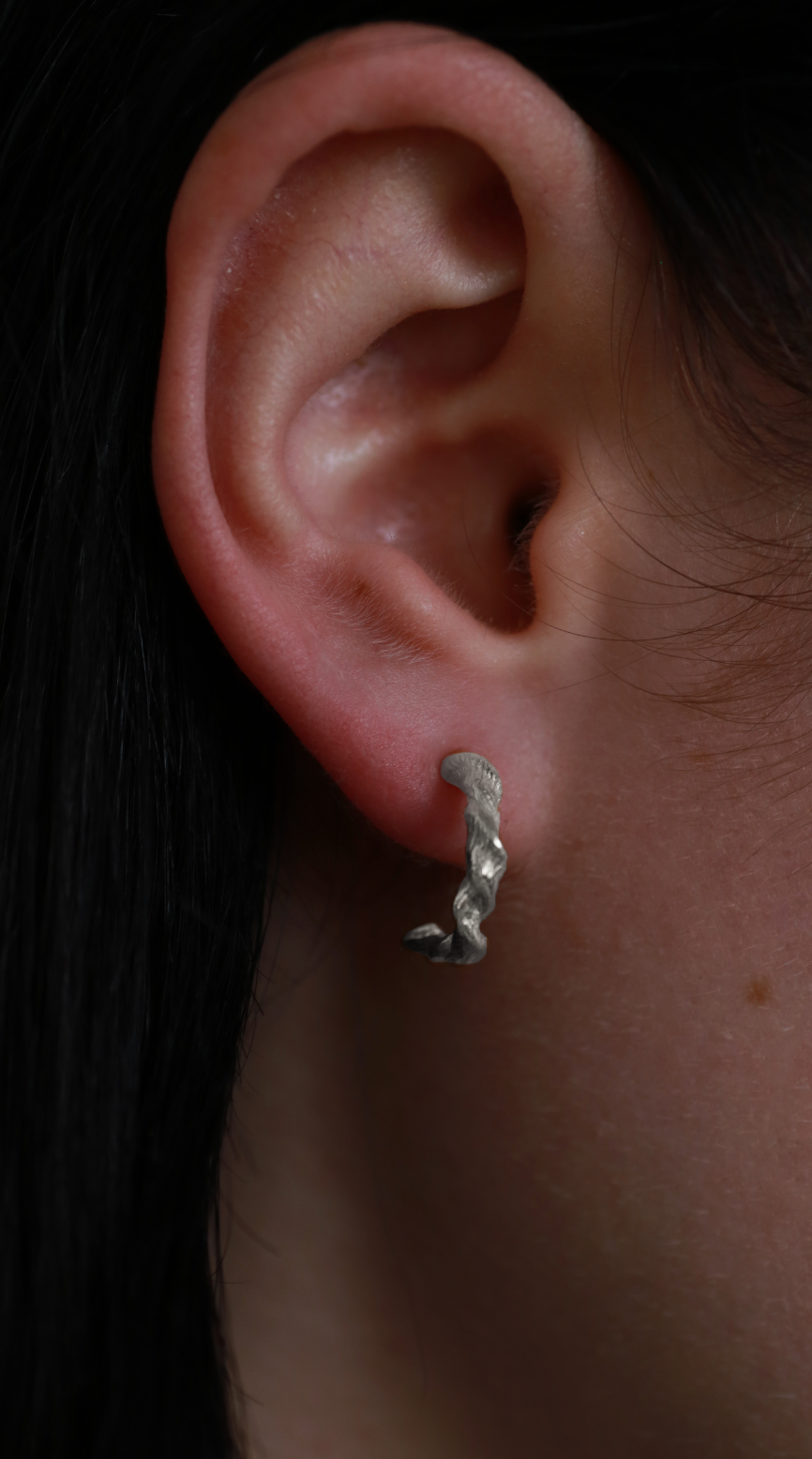 the twisted beeswax hoops sterling silver model shot