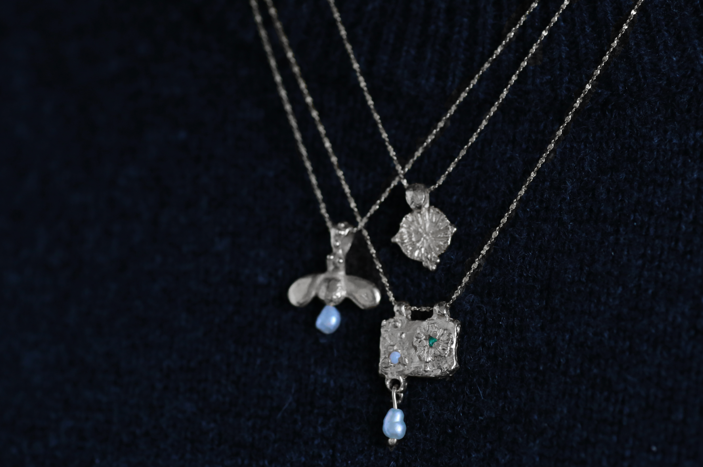 trio of stacking necklaces close up sterling silver